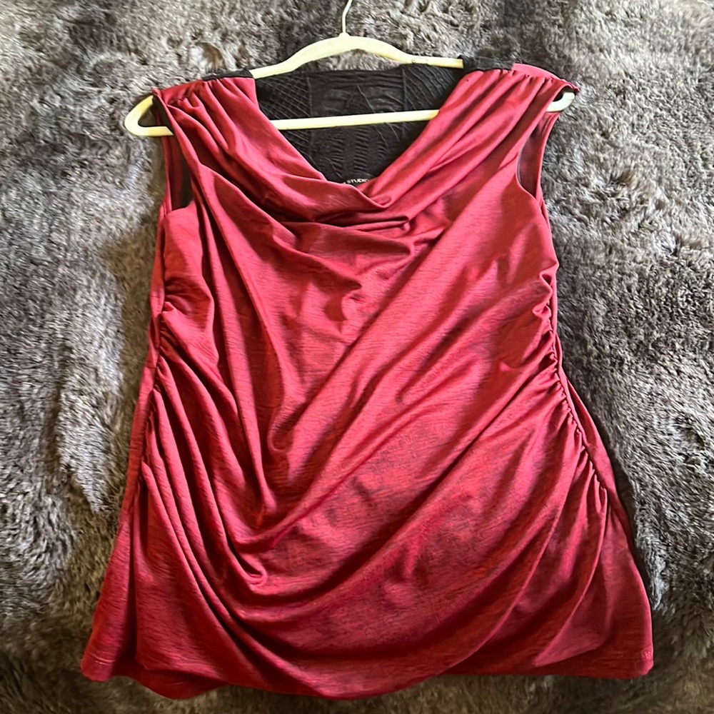 Red sleeveless blouse with design in the back